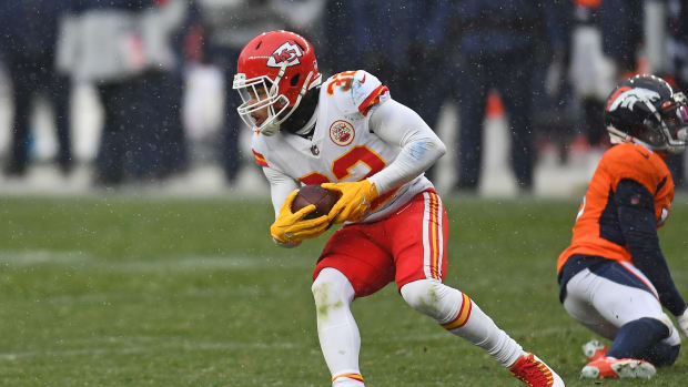 Oct 25, 2020; Denver, Colorado, USA; Kansas City Chiefs strong safety Tyrann Mathieu (32) intercepts the ball in the second half against the Denver Broncos at Empower Field at Mile High. Mandatory Credit: Ron Chenoy-USA TODAY Sports